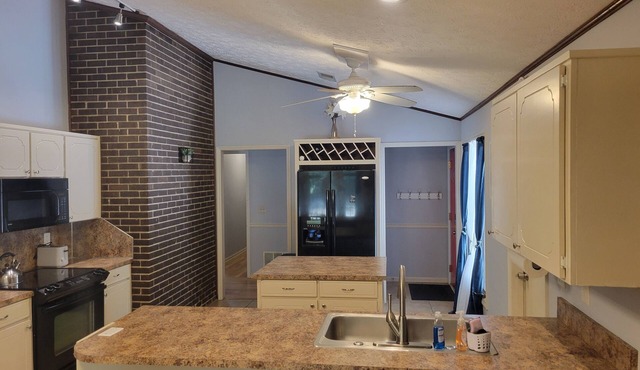 Charming 3-bedroom house secluded on 2 acers, but close to everything.