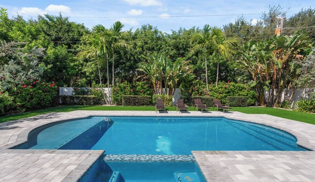 Charming 4-Bedroom Beach Bungalow with Idyllic Pool & Backyard