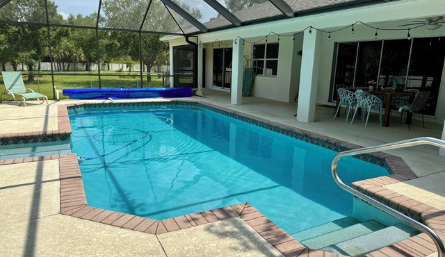 Charming 4-bedroom house in enchanting Lehigh Acres with an amazing pool!