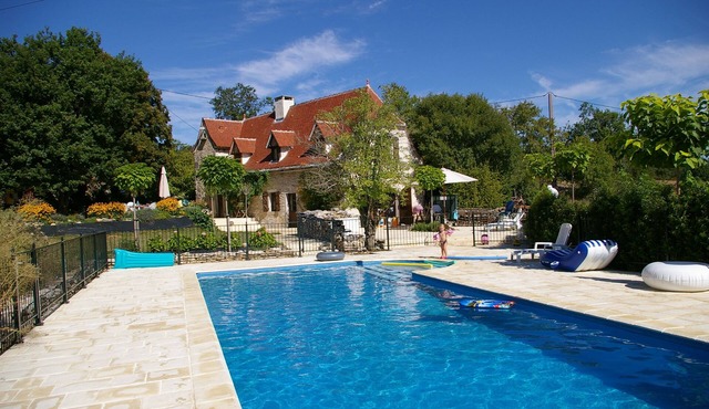 Charming air-conditioned house with heated fenced swimming pool and large garden