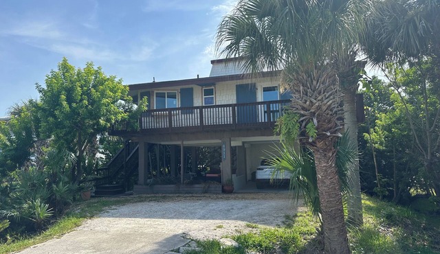Charming beachside bungalow steps from the beach.