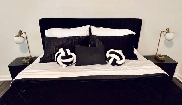 Charming black white & gold bedroom ensuite at The Retreat