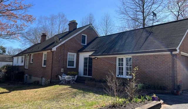 Charming brick ranch with an acre of beautiful garden