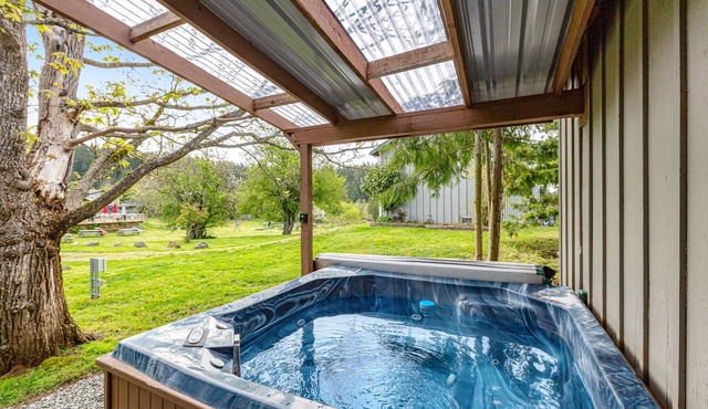 Charming & bright dog-friendly cabin with nature views, hot tub, and fireplace