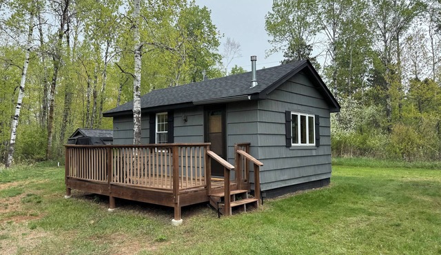 Charming cabin in delightful Duquette with AC near miles of ATV trails.