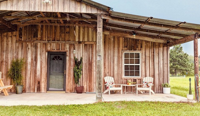 Charming country guest house on 20 acres with a private lake and hobby farm.