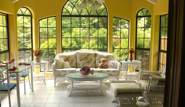 Charming country home nestled in nature down a short gravel road.