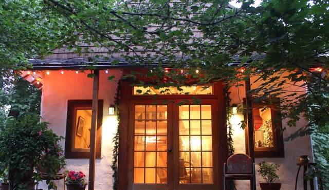 Charming cozy cottage secluded in private woods in great close in location.