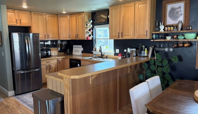 Charming, dog-friendly, 2-bedroom house in Three Forks with AC and fenced yard.