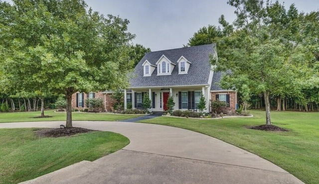 Charming farmhouse-style home on 3 acres with forest trails and seasonal creek