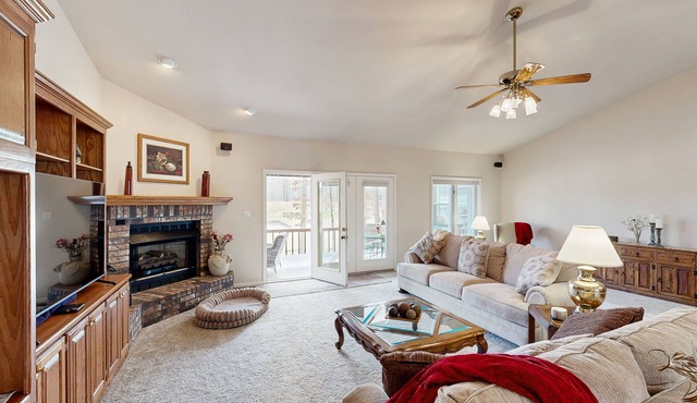 Charming Golf-front retreat with open living, covered porch & deck