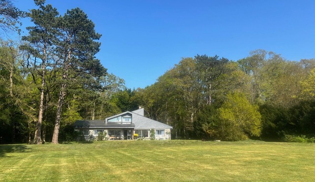 Charming house set in a landscaped garden close to the sea.
