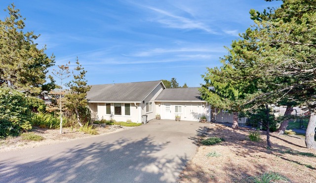 Charming home near ocean with patio, firepit, WiFi, streaming, and wood stove