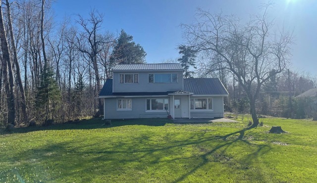 Charming house on the St. Mary's river in Sault Ste. Marie, freighters out front