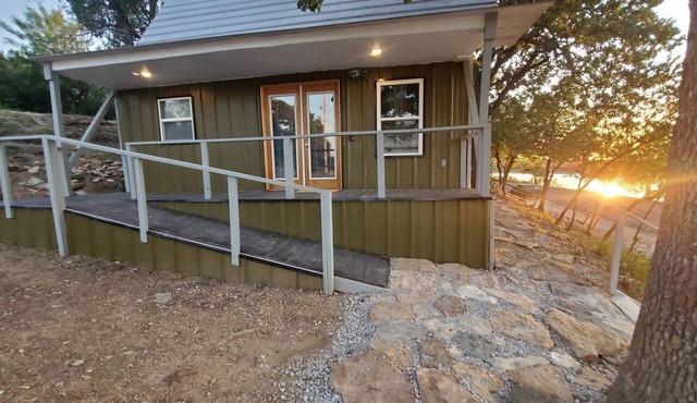 Charming Lakefront Cabin with Sandy Beach Access & Fire Pit Near Lake Cisco, TX
