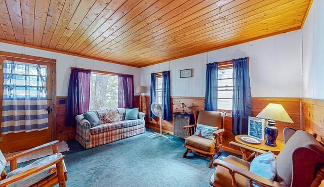 Charming lakefront cottage with large yard, dock, & fire pit - close to downtown