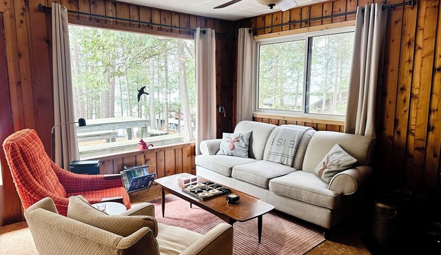 Charming lakefront cottage with private dock, stunning sunsets & cozy wood stove
