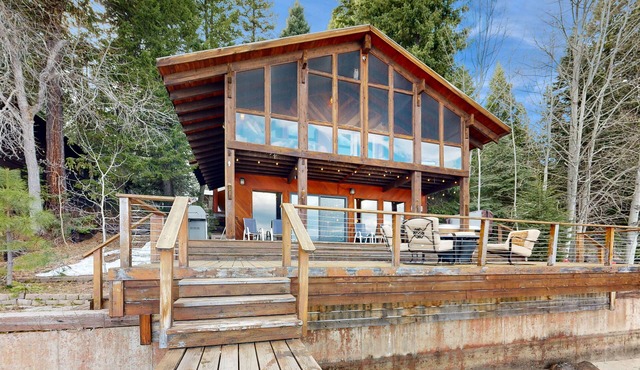 Charming lakefront home & cottage with a deck, hot tub, & washer/dryer