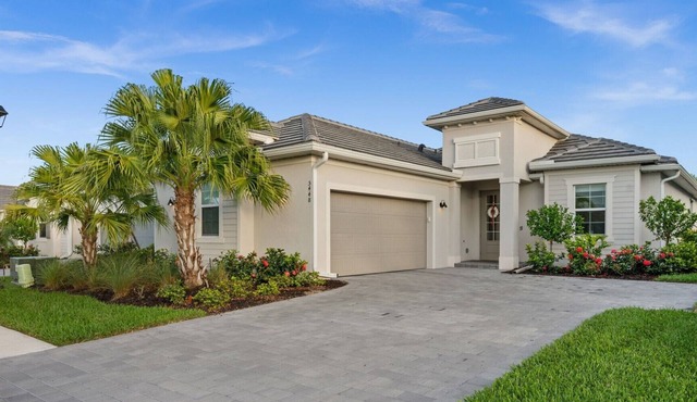 Charming lakeside home with pool, spa and modern coastal design.