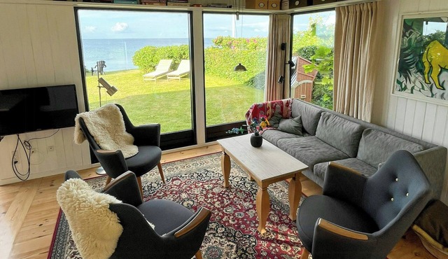 Charming little summer house right by the water