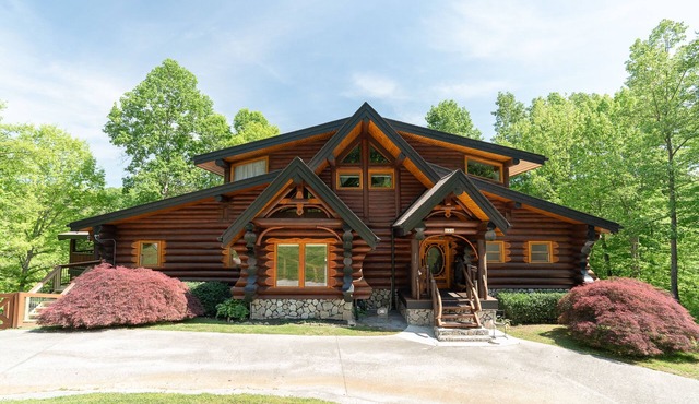 Charming log home with stunning lakefront views, hot tub, boat rental available