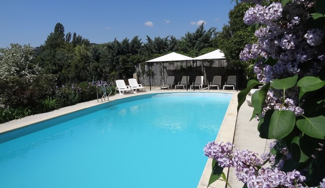 Charming period dovecote with communal swimming pool, plane trees and fountains