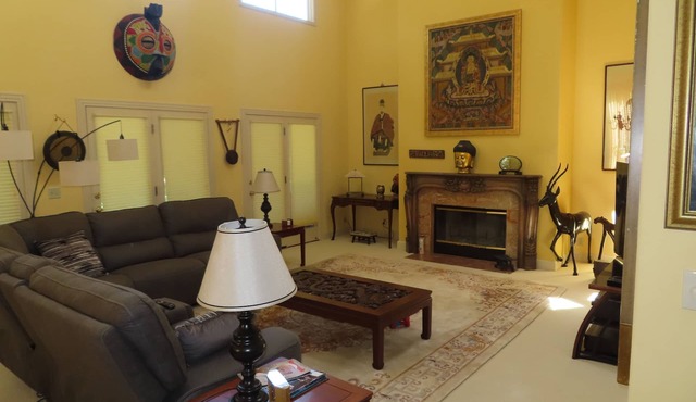 Charming quiet single story home amongst coast live oak trees in gated community