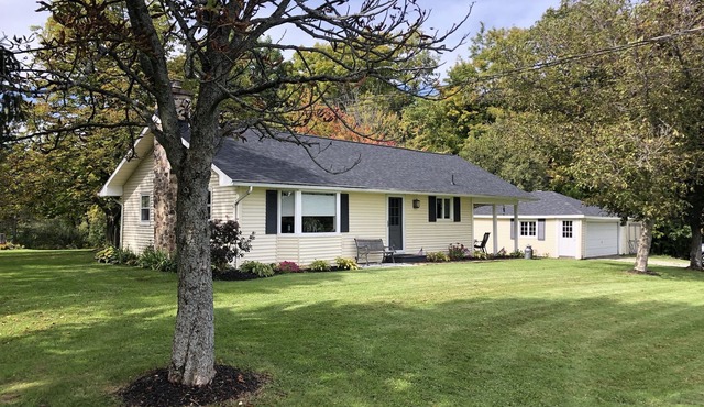 Charming, recently updated country ranch home on quiet, scenic, acre lot.