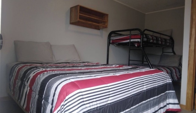 Charming remodeled motel room in Hemphill with Wi-Fi, mini fridge & microwave.