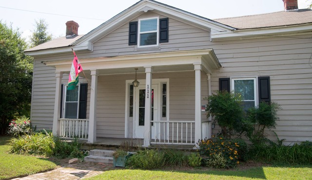 Charming restored Victorian Farmhouse and cottage on a large rural lot.