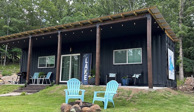 Charming shipping container home with lake view and boat ramp.