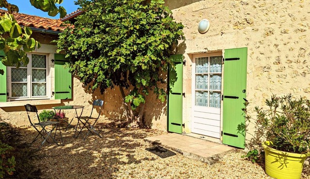 Charming stone cottage in Bellon with garden, fireplace and internet