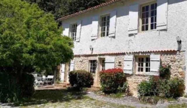Charming stone house nestling on the edge of the forest