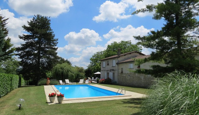 Charming stone house in a park with trees on the hillsides of Bordeaux