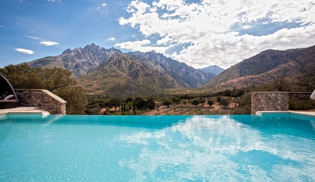 Charming stone house with views of the sea, mountains and swimming pool.