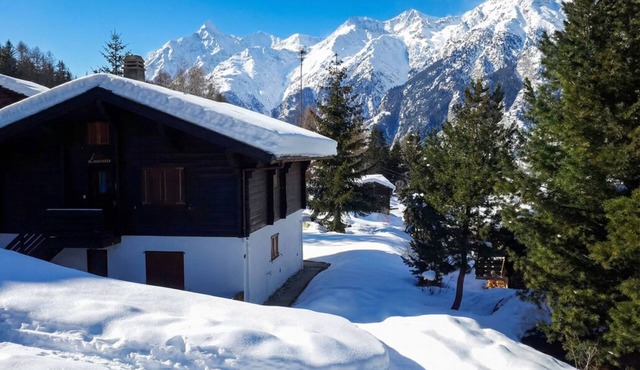 Charming Swiss chalet with stunning mountain views.