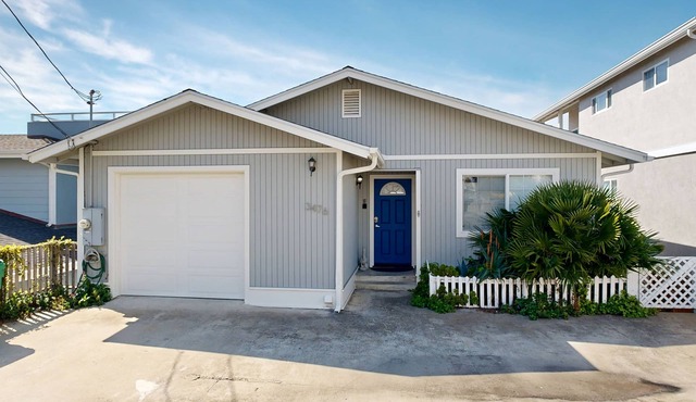 Charming, two-story home with deck, grill, and ocean views