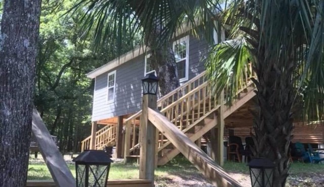 Charming waterfront barndominium on the beautiful spring-fed Chipola River.