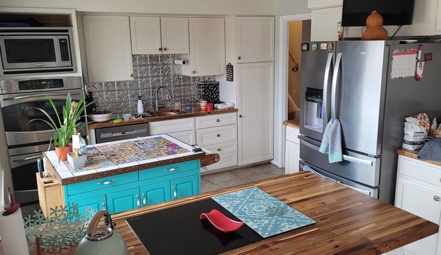 Cheerful 4-bedroom home with backyard and pet friendly.