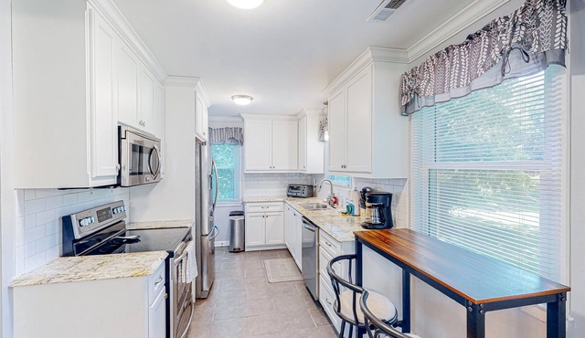 Cheerful dog-friendly home with a large yard, central AC, patio, & washer/dryer