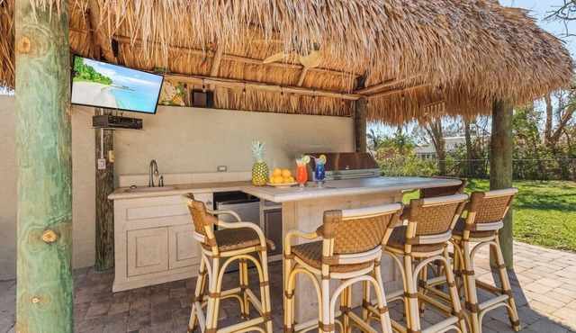 Cheers to Paradise: Pool, Tiki Bar, & Endless Fun!