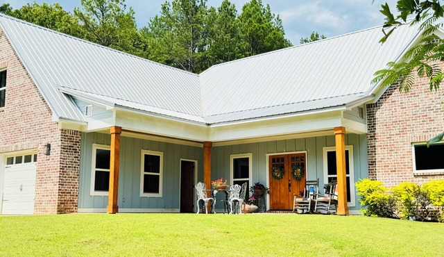 Chef designed kitchen, 3 living spaces, surrounded by woods for privacy!