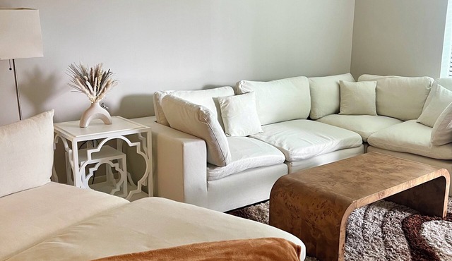 Chic 2-bedroom deluxe apartment with king beds, large Tvs, and a fitness center.