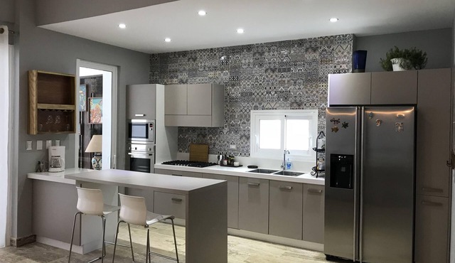 Chic and modern condo steps away from dream-like white sand beach