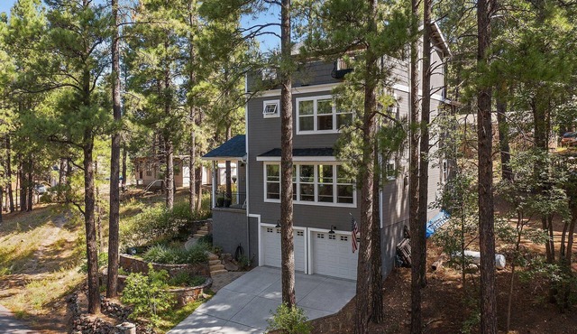 Chic home sleeps 9, has a hot tub, 3rd floor balcony, and EV Level 2 Charger