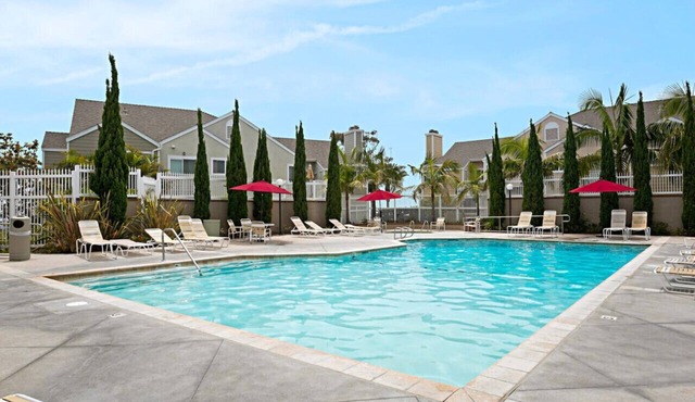 Chic Upstairs Condo Steps from Strands Beach