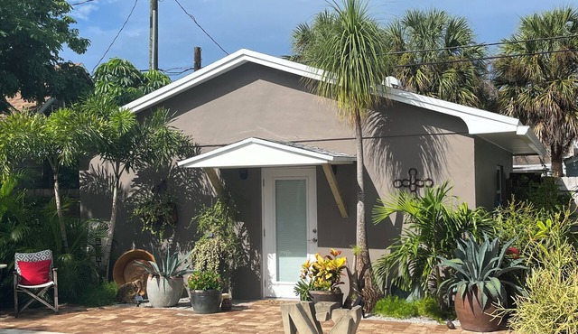 Chill on the patio overlooking the pool & lush gardens with privacy!