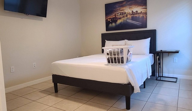 City Lights Queen Bedroom with Shared Lavatory