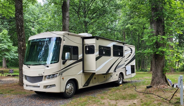 Class A RV on a private 5 Acre Property with RV campsite and trail.