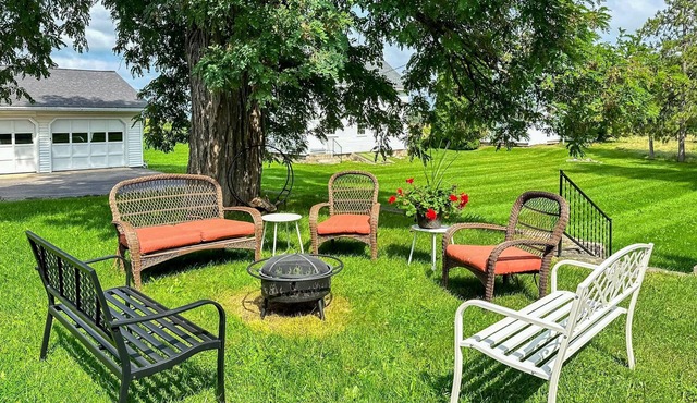 Classic country retreat with a game room, bar, expansive outdoor space, & grill